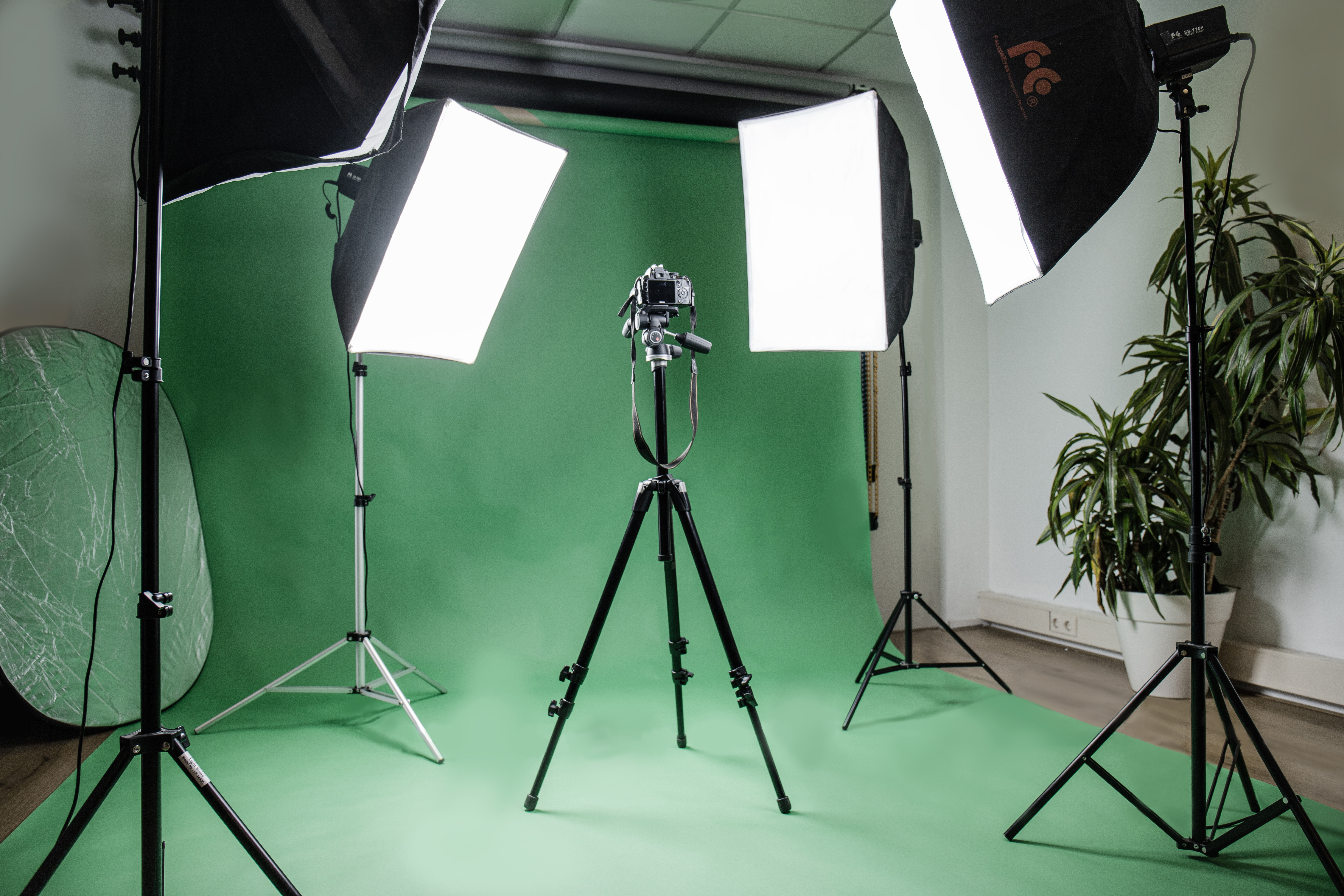 Creative workspace with Adobe software and camera equipment